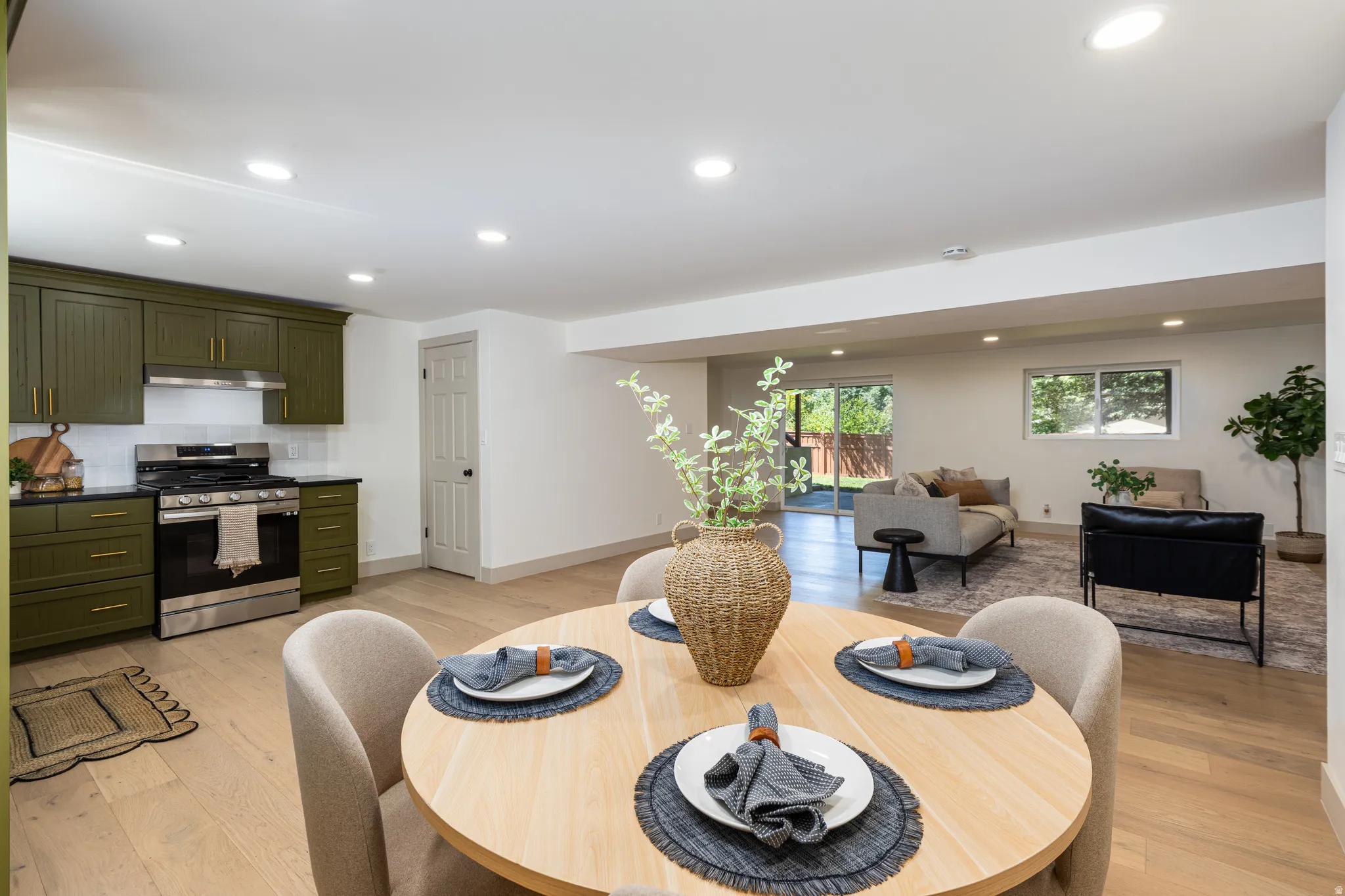 Open-concept living space featuring wood-finish flooring