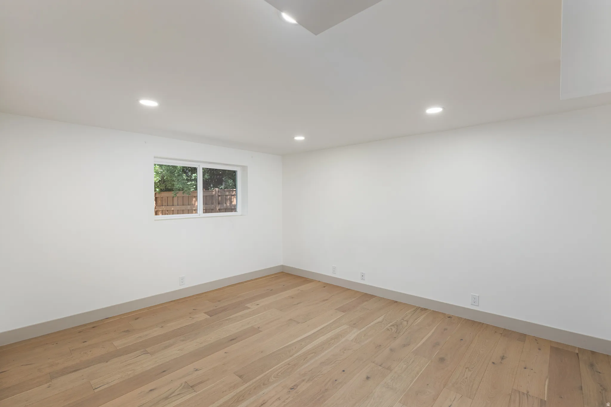 Hardwood flooring complementing white walls