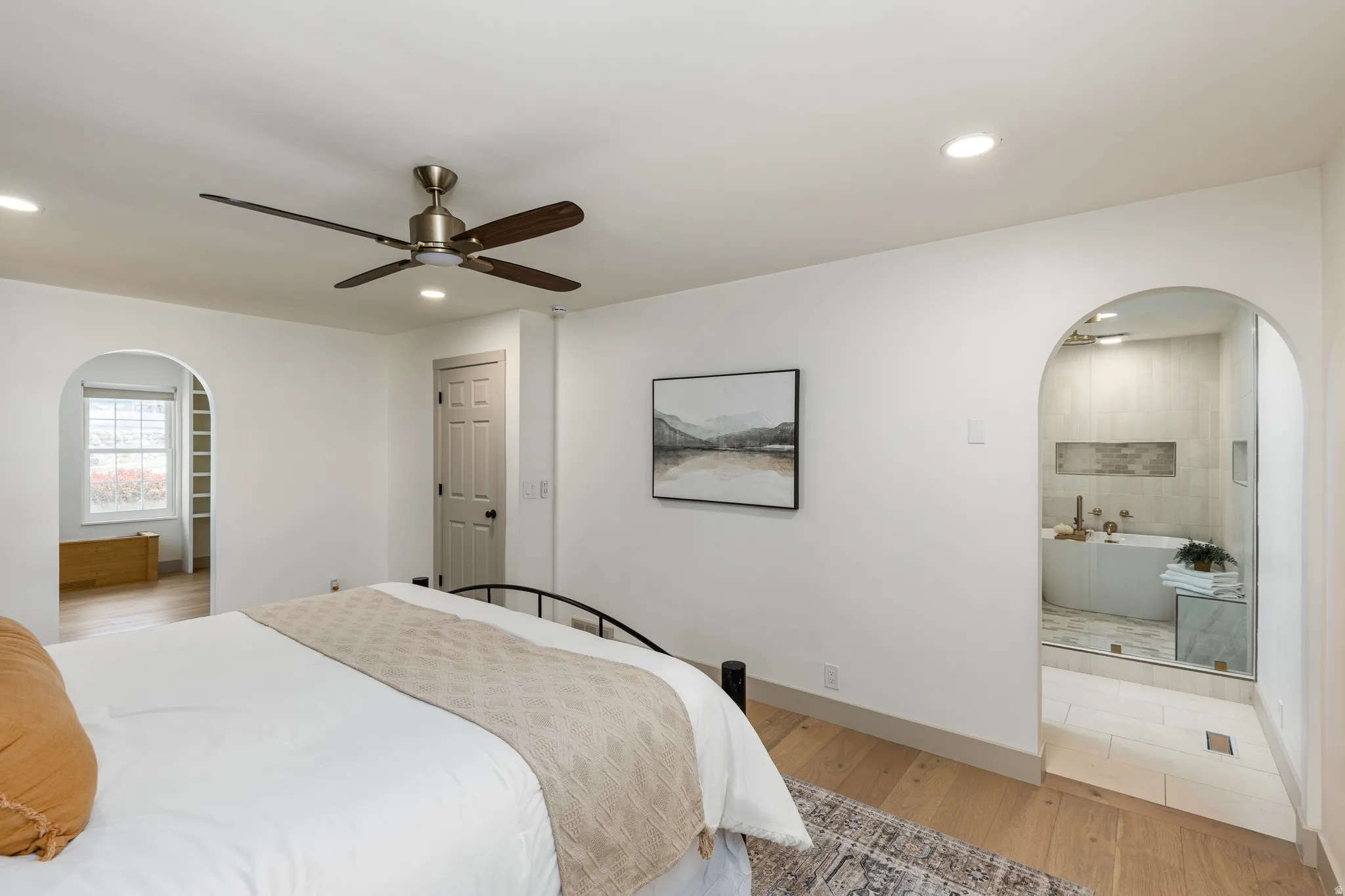 Bedroom featuring light wood-finish flooring, recessed lighting, and a ceiling fan