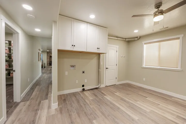 Large Laundry room with space for crafts or workout room.
