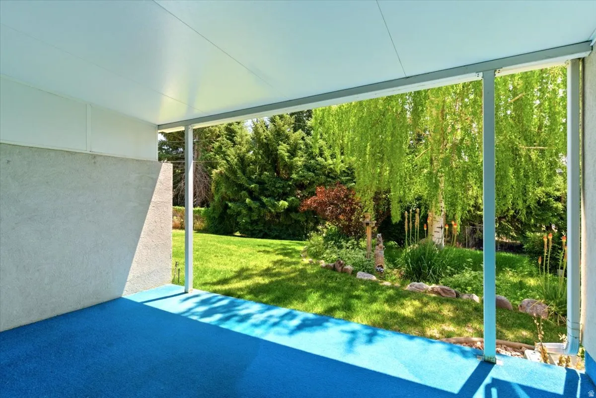 Covered patio with blue outdoor carpeting