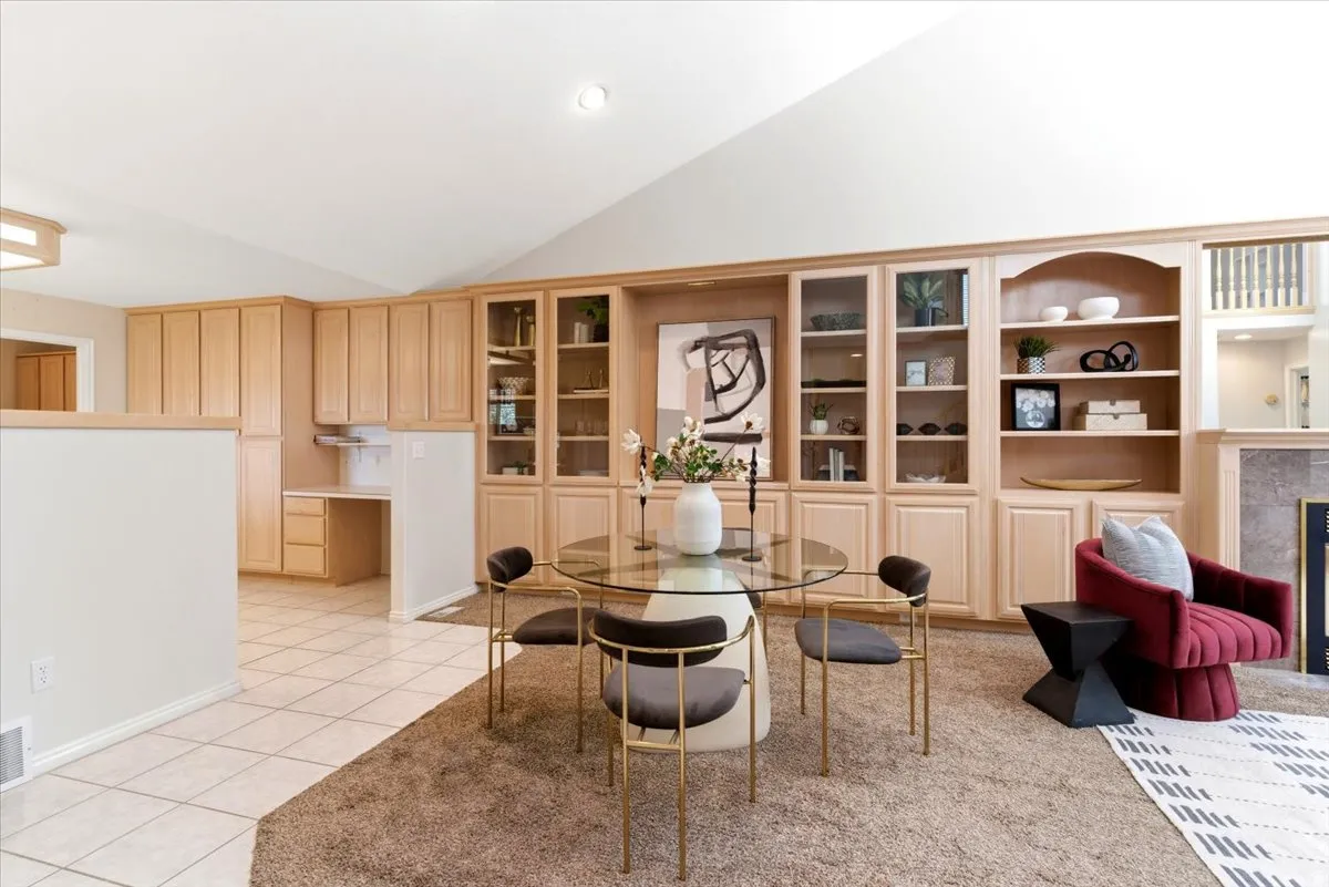 Built-in cabinetry and shelving with glass-front uppers and open display areas