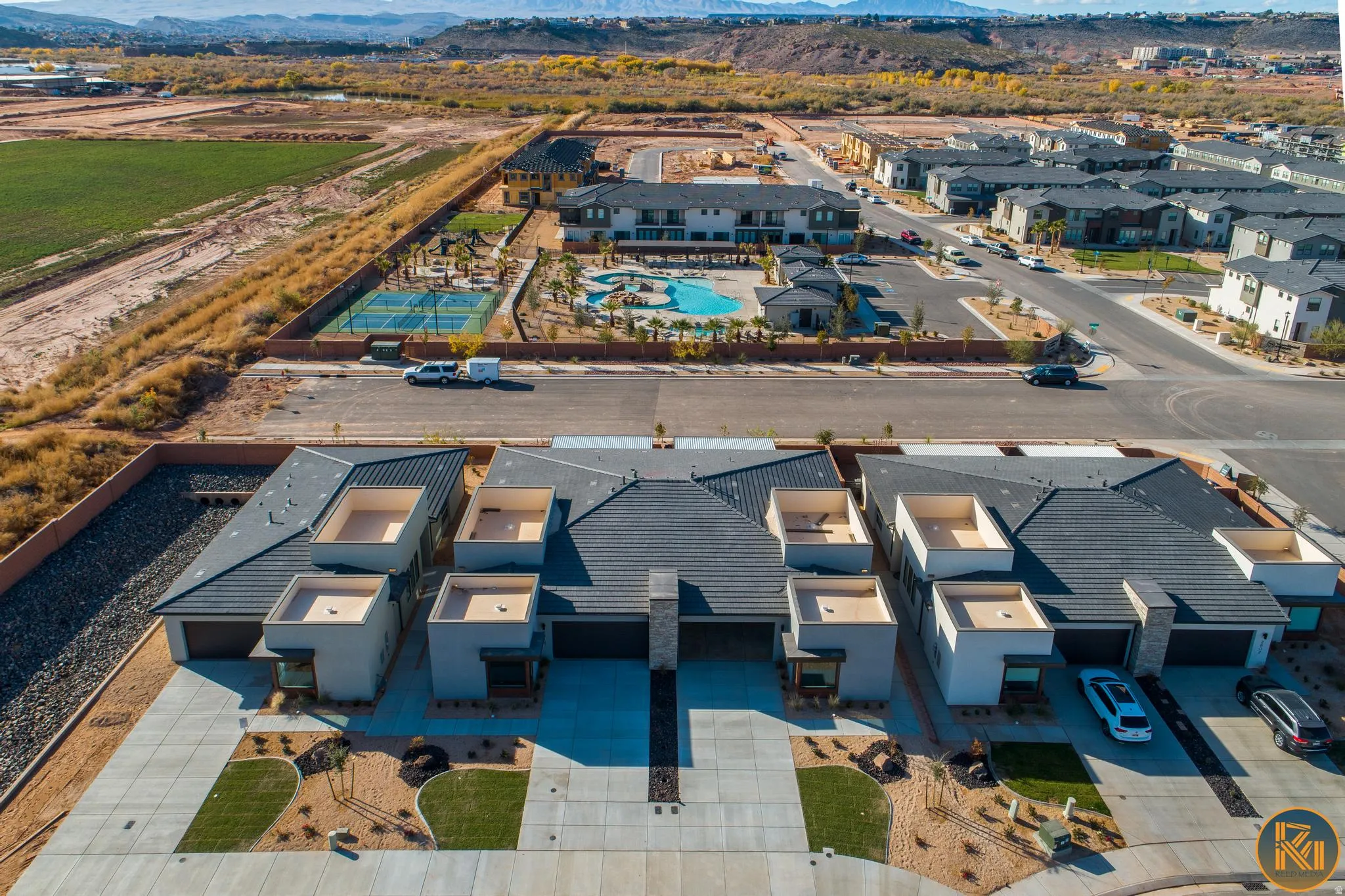 Modern residential development featuring multi-unit structures with individual garages