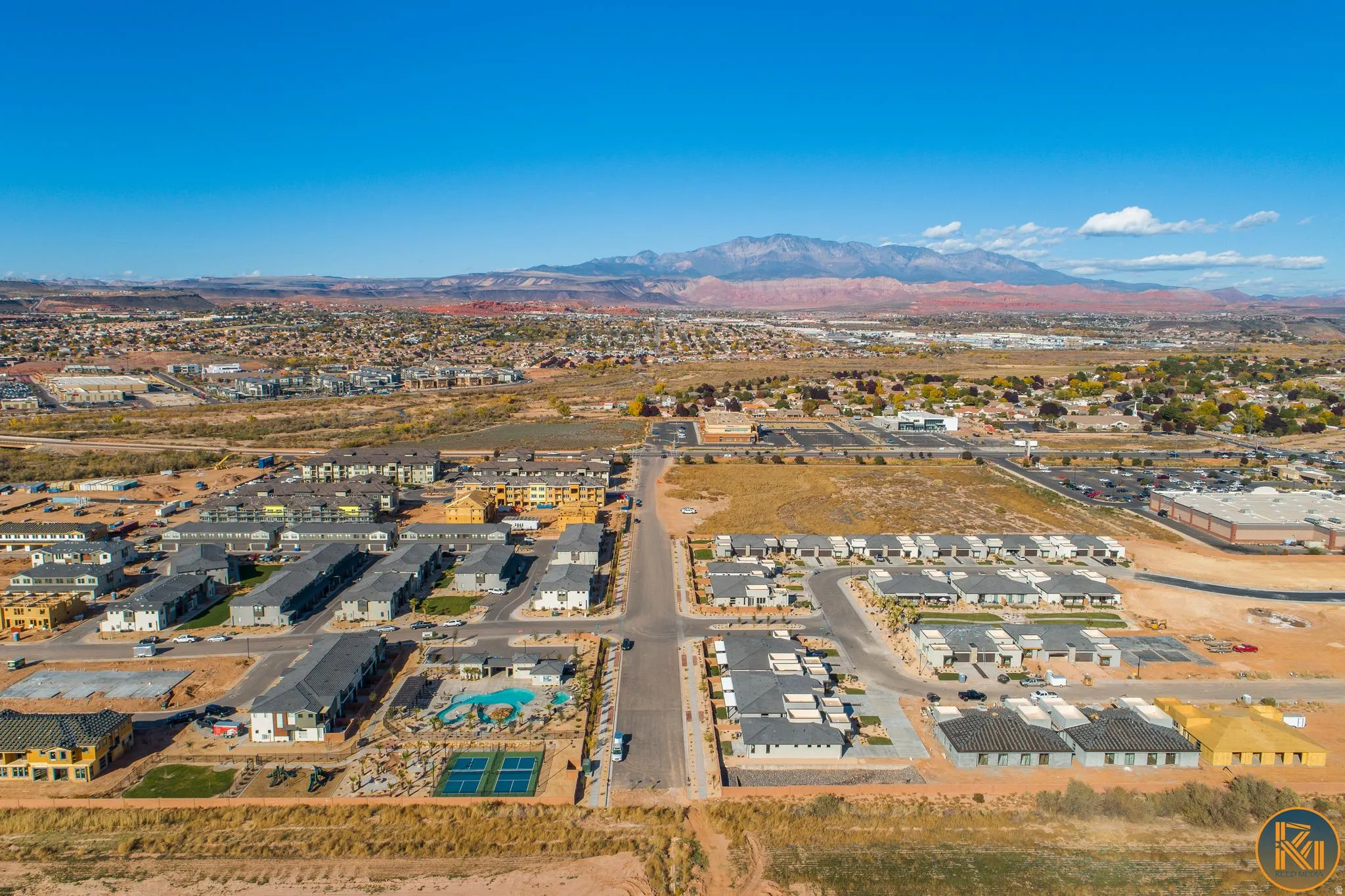 Community featuring a swimming pool, tennis courts, and diverse residential buildings