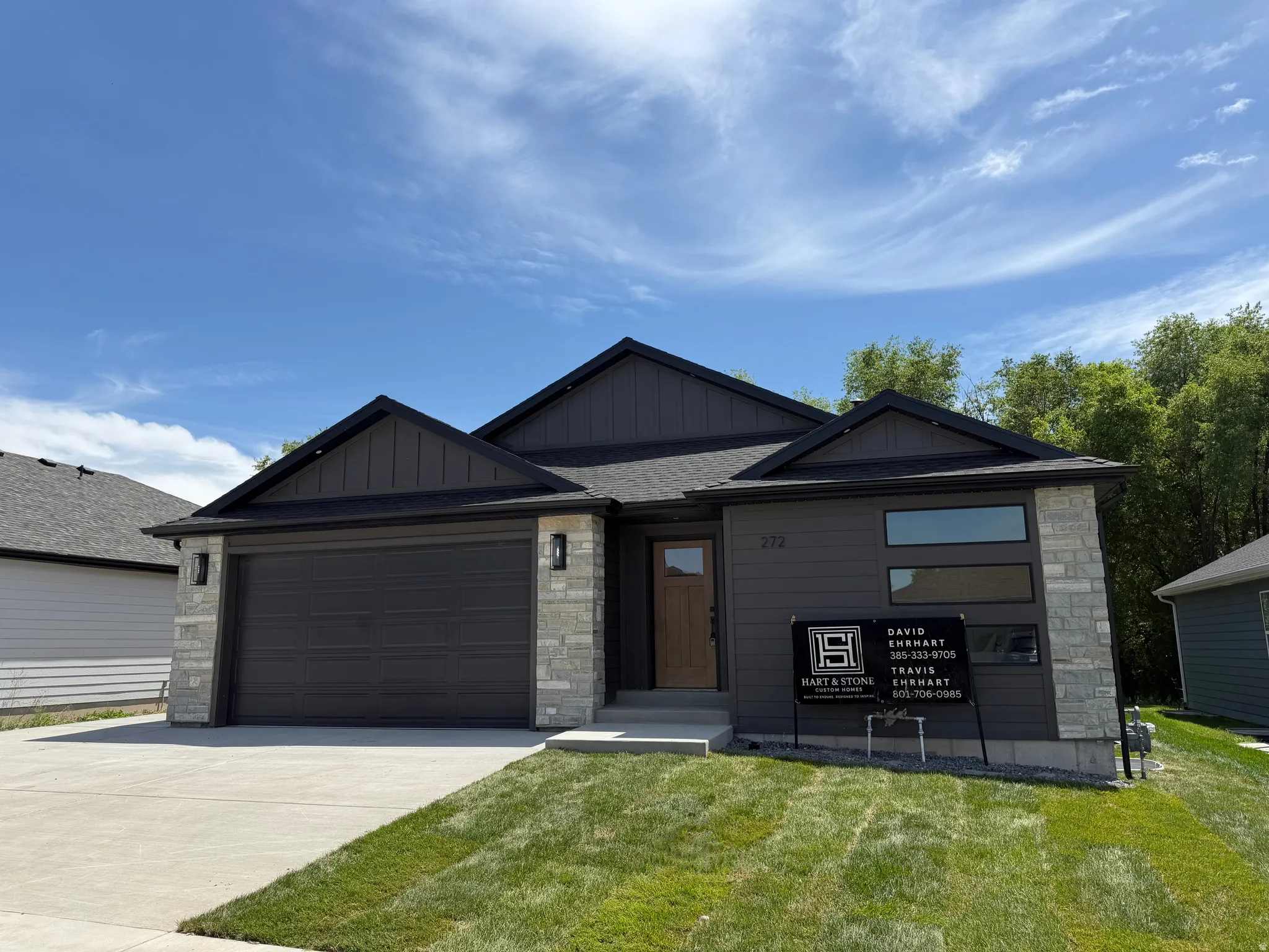 Contemporary dark gray exterior with stone accents