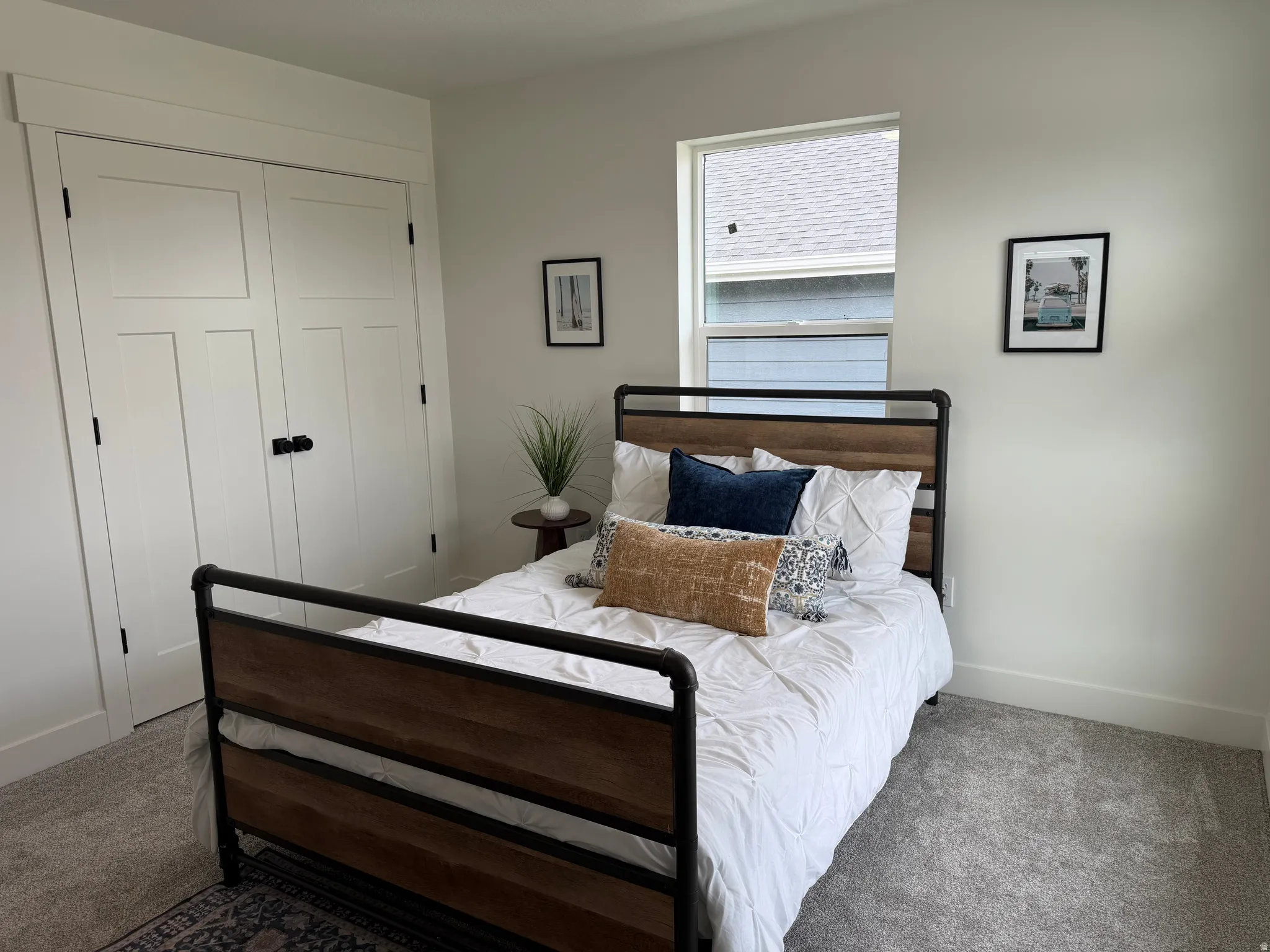 Interior room featuring light gray wall paint and matching carpet flooring