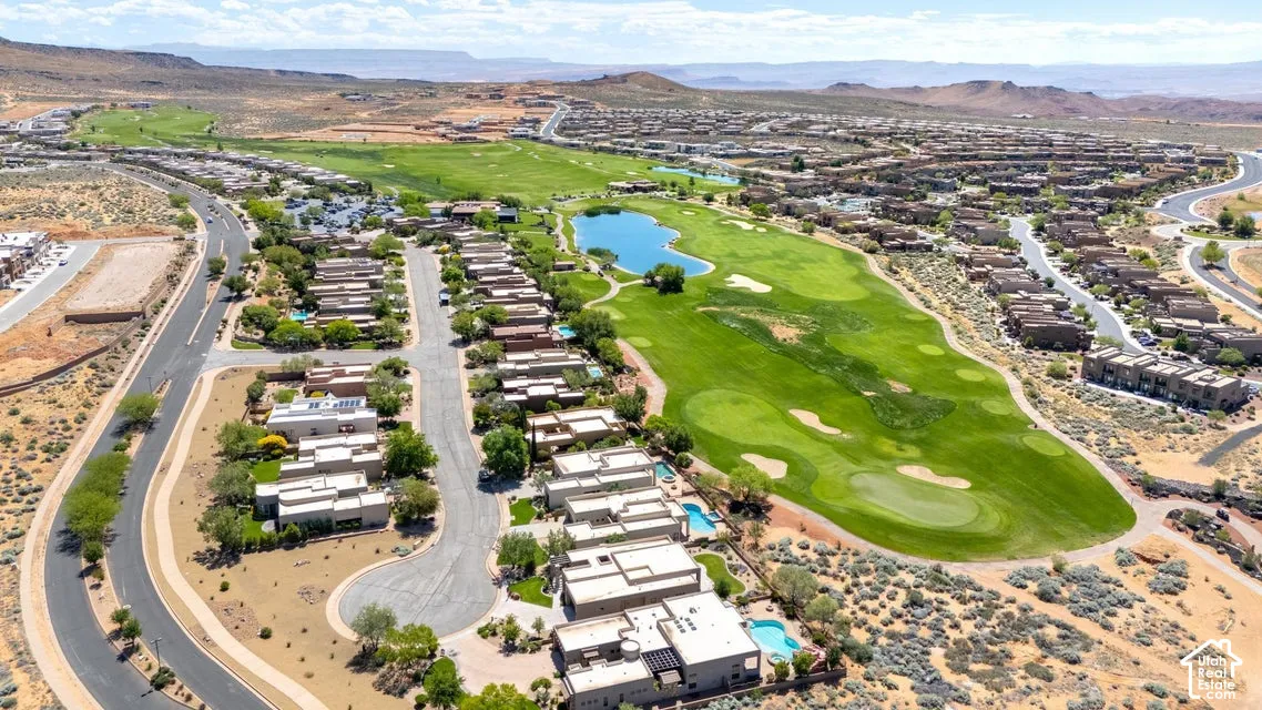Aerial perspective showcasing residential properties bordering a manicured golf course