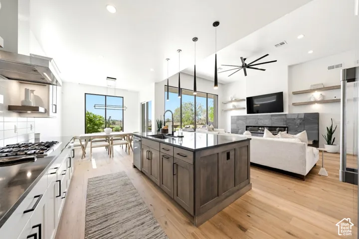 Open-concept living space featuring light wood-finish flooring