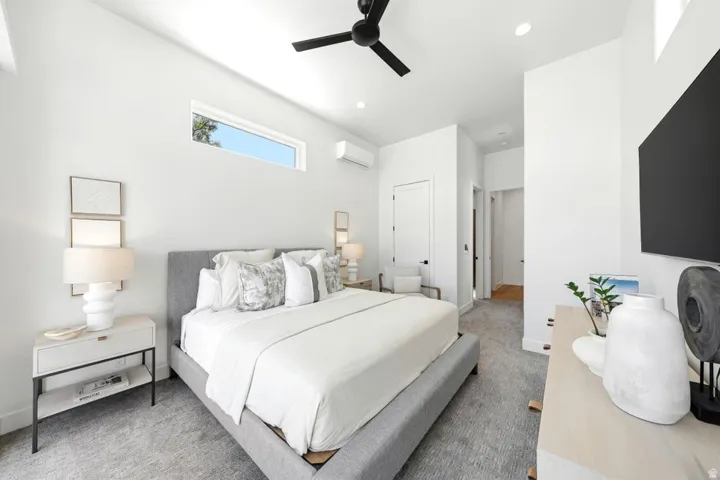 High ceilings featuring a black ceiling fan with recessed lighting