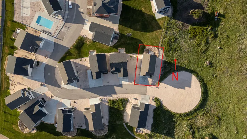 Residential property situated on a cul-de-sac with a distinct red boundary line