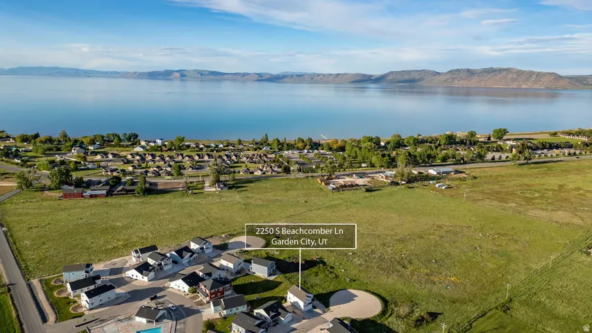 Aerial perspective showcasing a residential development with water frontage
