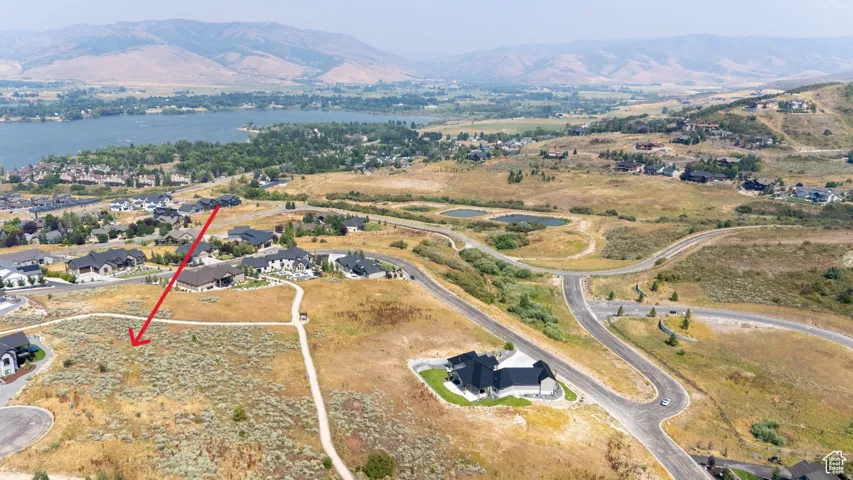Expansive land parcel featuring natural, arid vegetation and a flat building site