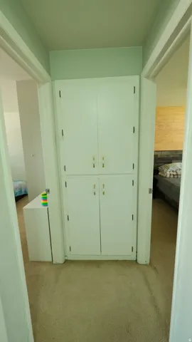 Built-in white cabinetry with gold-tone hardware
