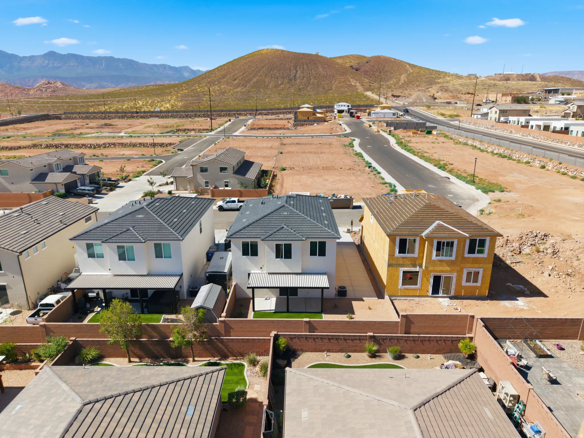 Newly constructed residential property featuring a stucco exterior and multi-pane windows