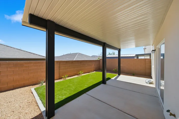 Covered patio featuring a concrete slab and a ribbed ceiling