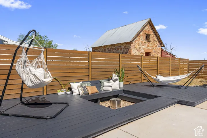 Multi-level backyard decking with dark-stained wood-finish flooring