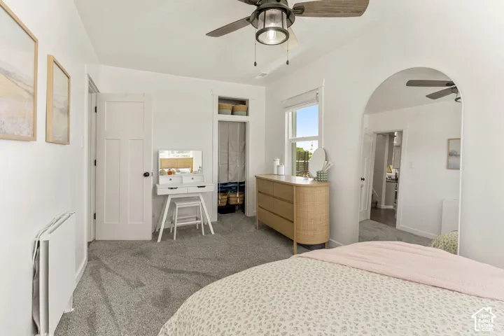 Bright room featuring light grey carpeting and white walls