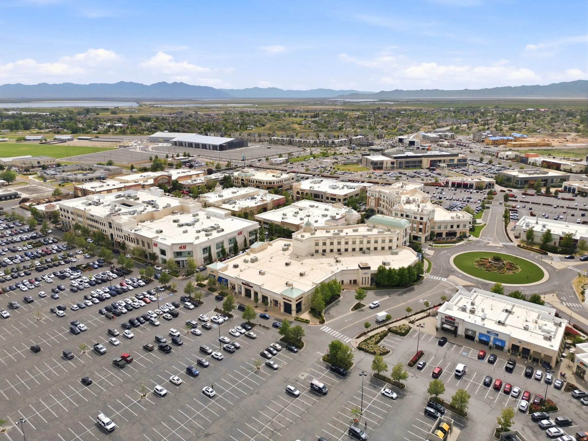 Expansive commercial development featuring multiple retail buildings with ample surface parking