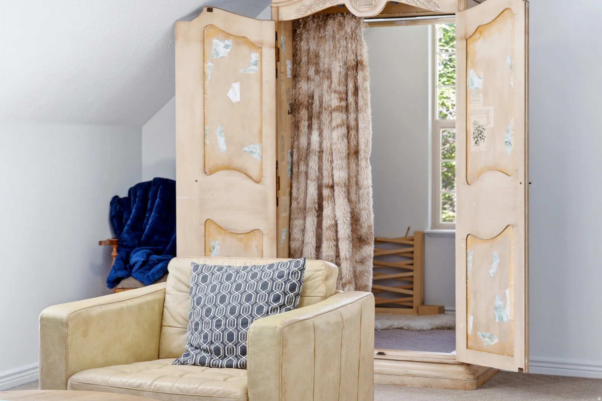 Built-in wardrobe with decorative doors and interior window access