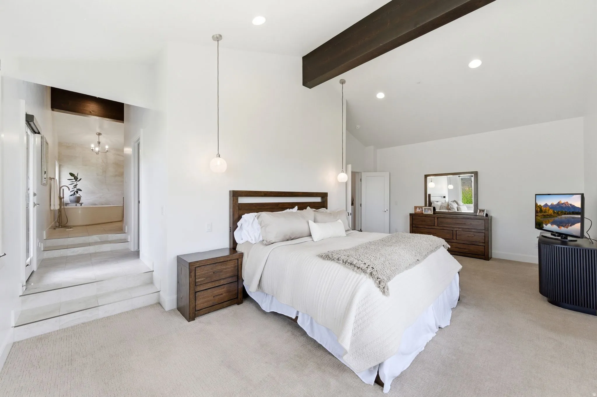 Vaulted ceiling with an exposed wood beam