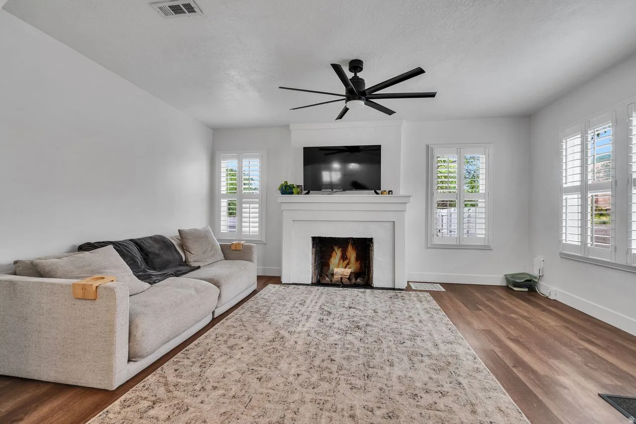 Front Living Room with Fireplace.  Plantation Shutters on the windows