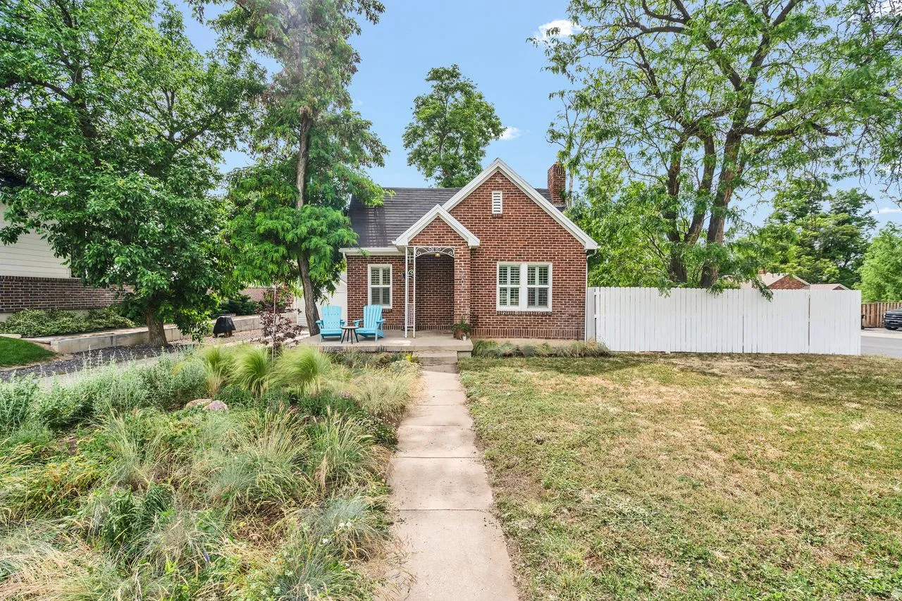 Red brick bungalow with a covered entry