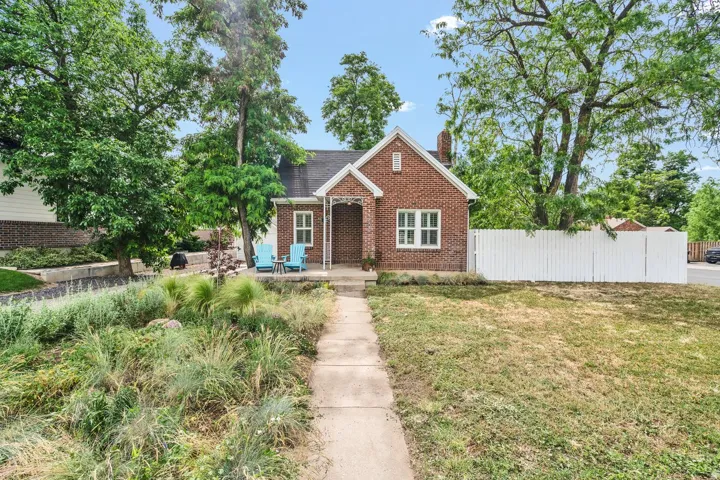 Red brick bungalow with a covered entry