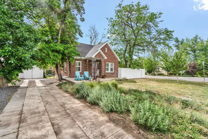 Front house with picture of the driveway to the garage
