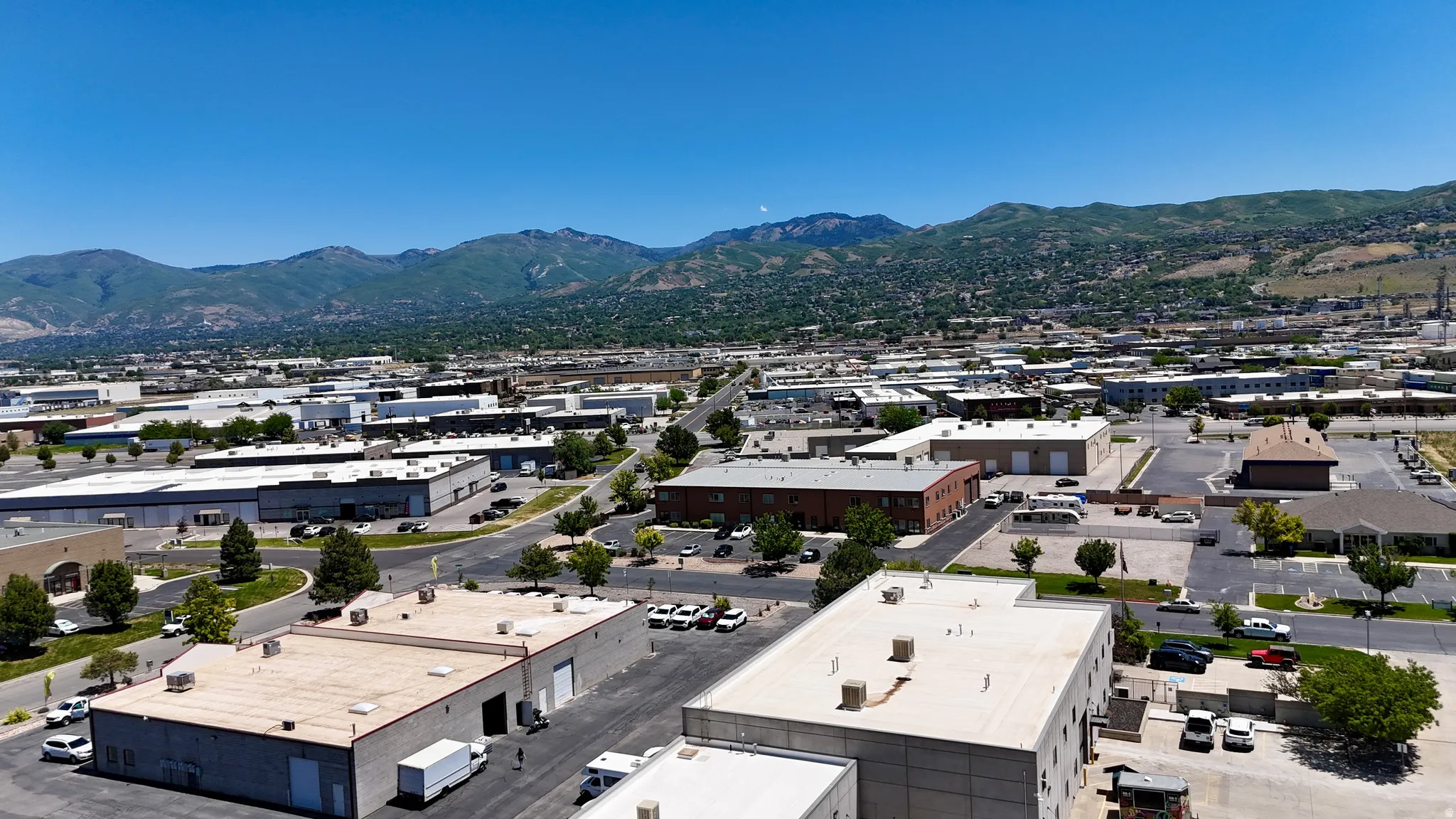 Expansive urban landscape with mountainous terrain backdrop