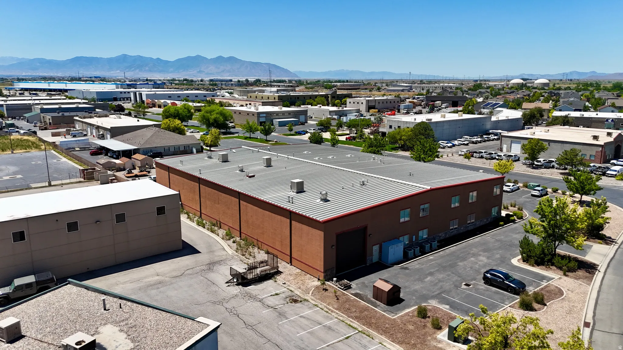 Commercial building featuring a brick exterior and a metal roof