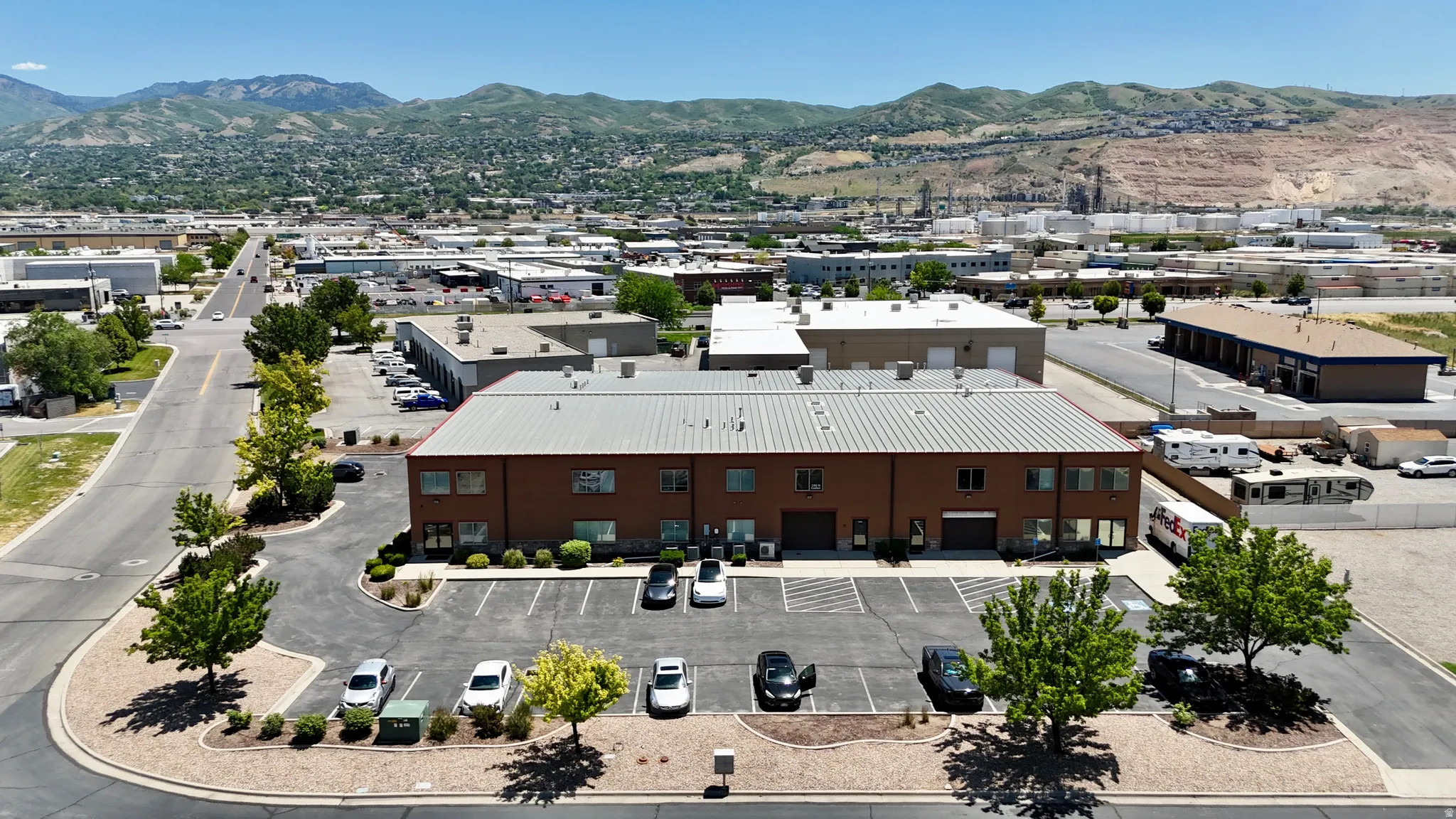 Commercial property featuring a brick exterior and a metal roof