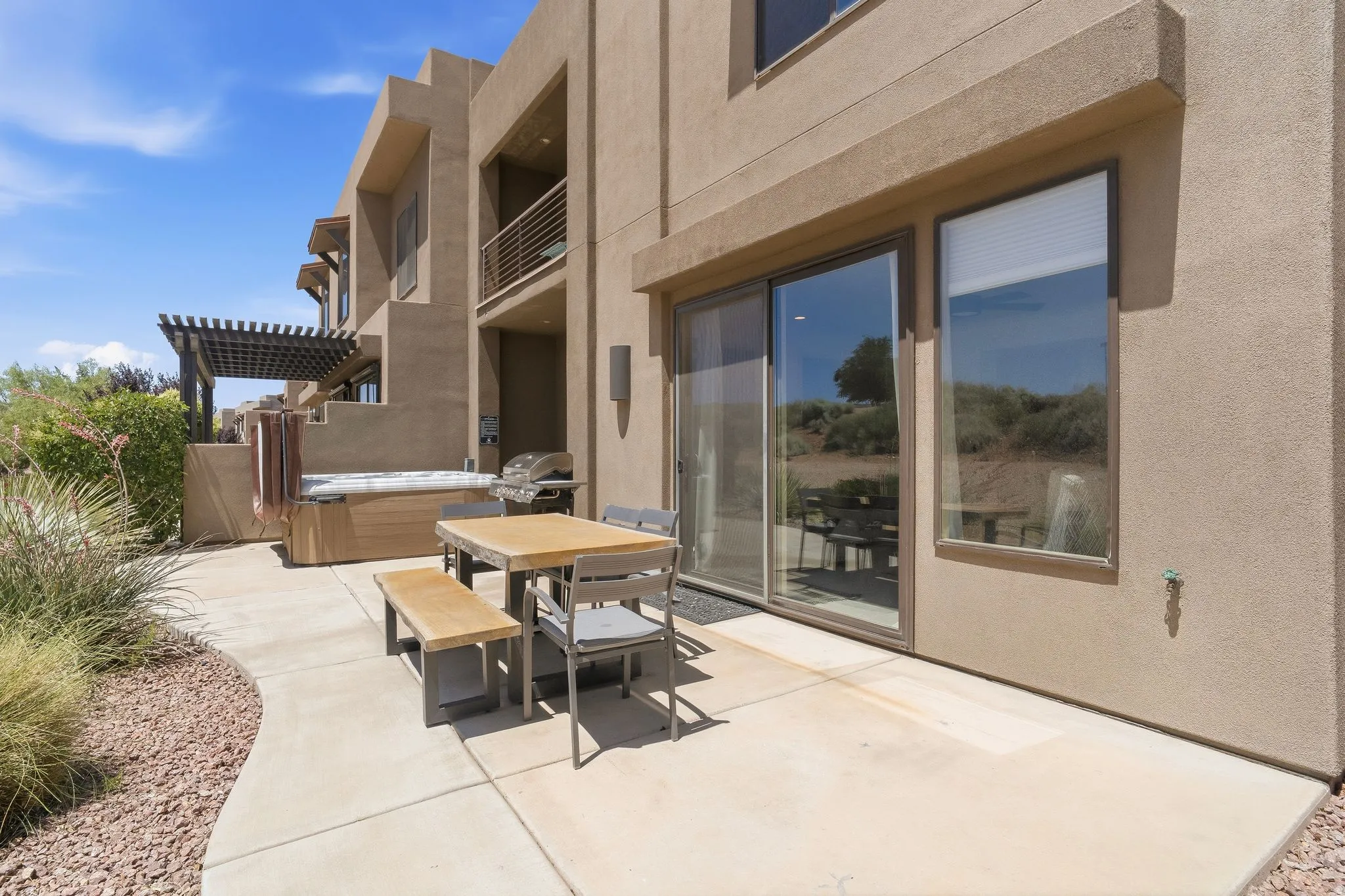 Back patio, hut tub, grill, and indoor/outdoor living