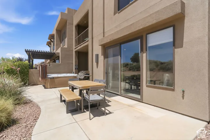 Back patio, hut tub, grill, and indoor/outdoor living