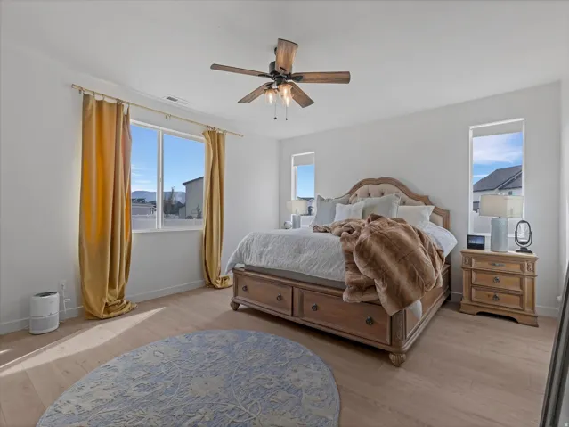Light wood-finish flooring complements the neutral wall tones