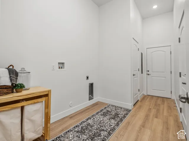Laundry room with additional storage and access to the garage and common breezeway.