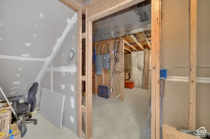 Unfinished interior space featuring exposed framing and drywall installation