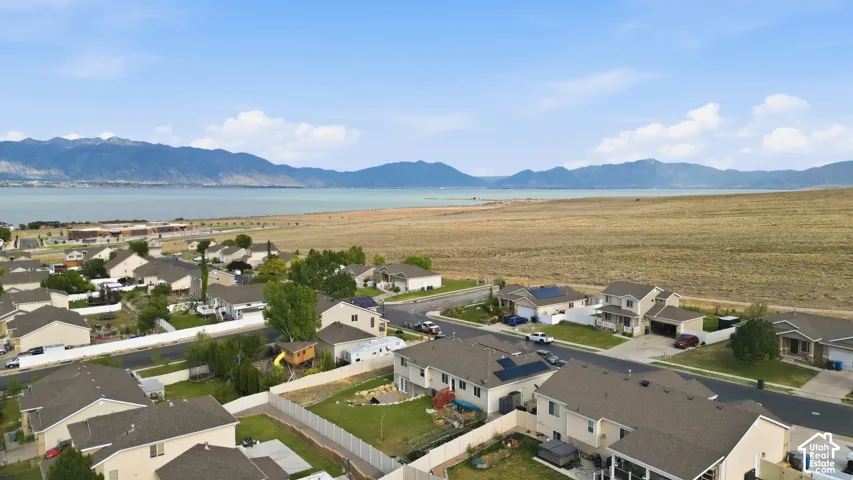 Residential community with distant mountains and a large body of water
