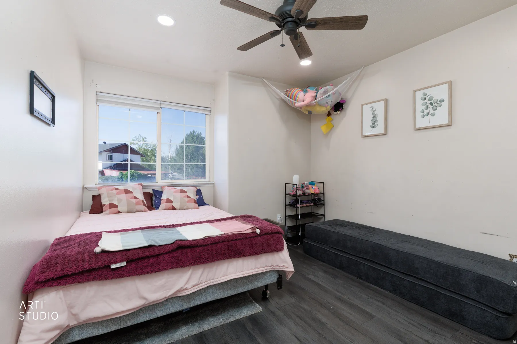Room featuring wood-finish flooring, a ceiling fan with integrated lighting, and recessed ceiling lights