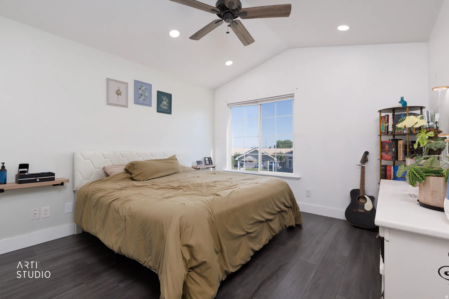 Vaulted ceiling bedroom featuring dark wood-finish flooring, recessed lighting, and a modern ceiling fan