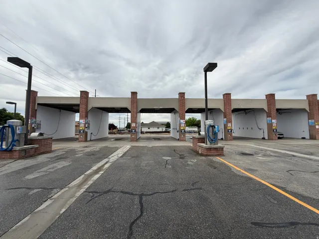 Commercial car wash facility featuring multiple bays