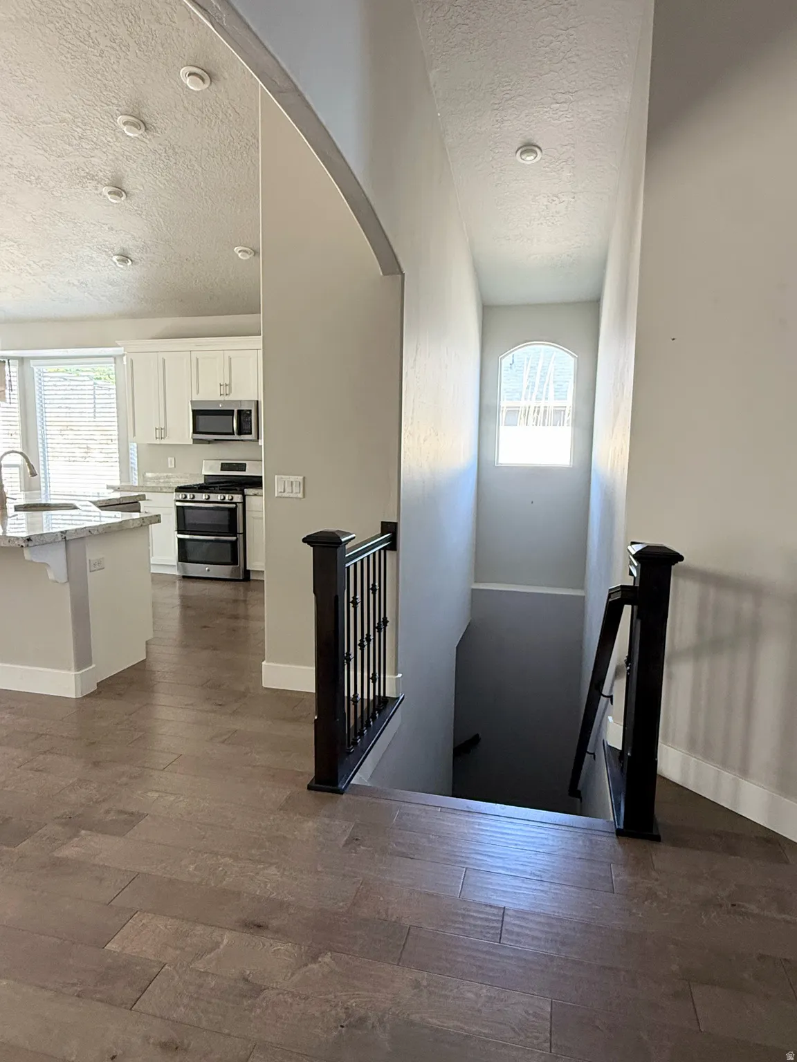 Open-concept design, stairs leading to the basement