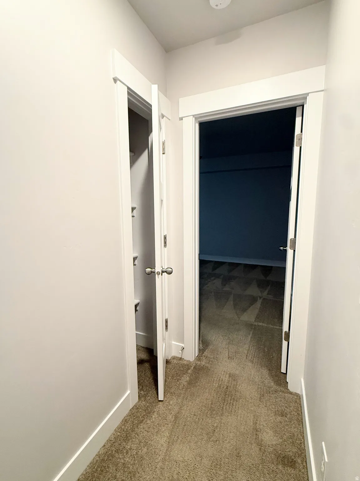 Hallway featuring linen closet