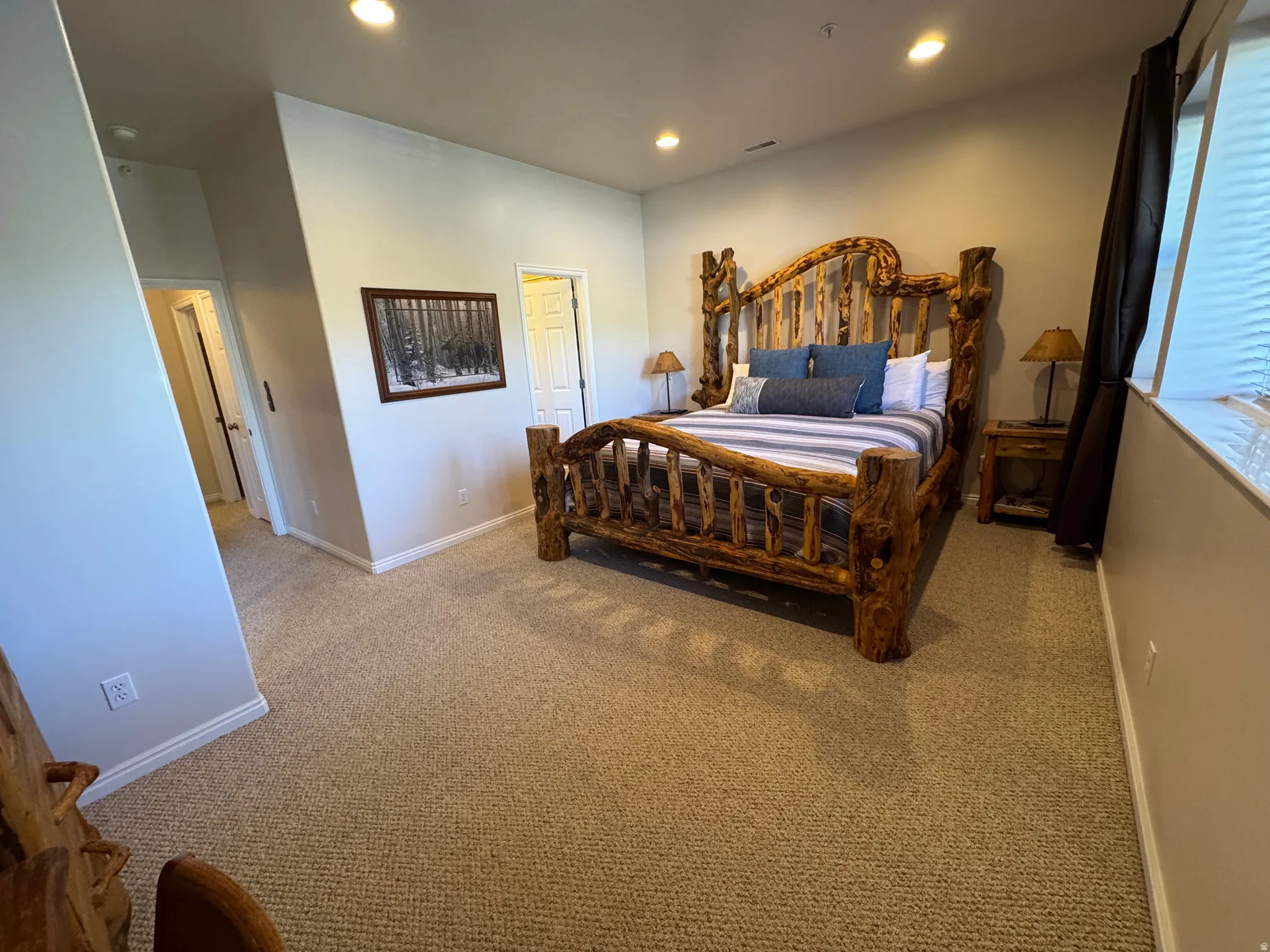 Primary bedroom with large closet and attached bathroom
