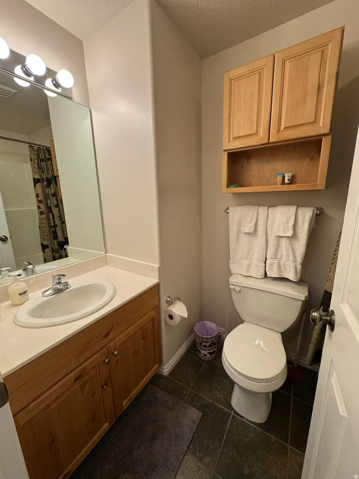 Lower level shared bathroom with tub/shower combo