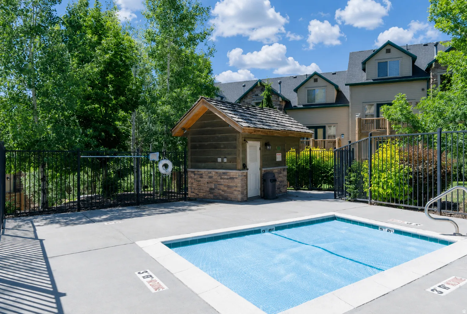 Outdoor spa is located in the common area accessed through your back door.