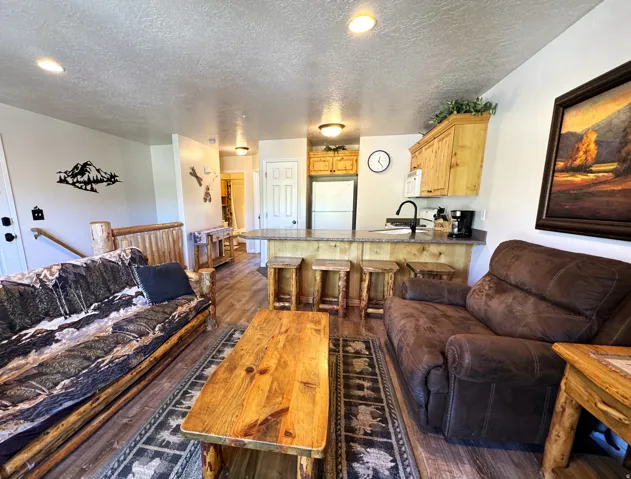 Open-concept living area featuring LVP flooring