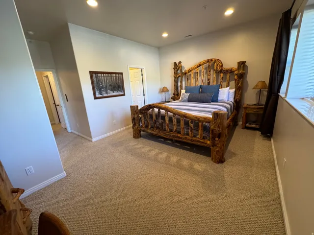Primary bedroom with large closet and attached bathroom