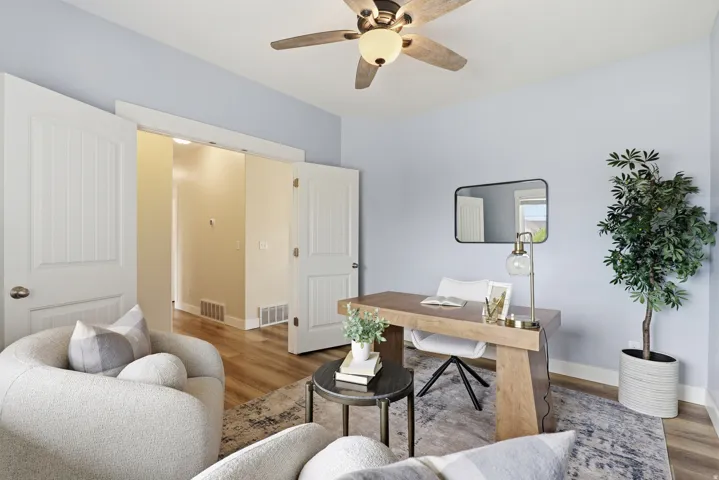 Light blue walls complement wood-finish flooring