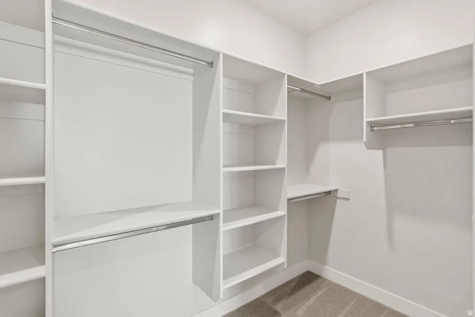 Built-in closet system with multiple shelving units and hanging rods