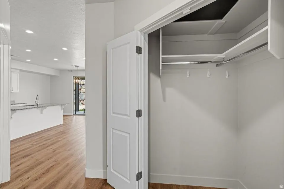 Open closet with integrated shelving and hanging rods